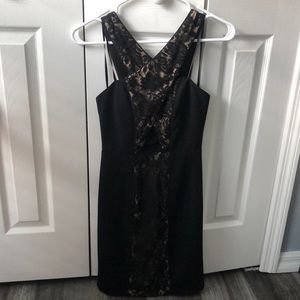 Black and lacy dress with criss cross top